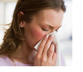 Woman sneezing